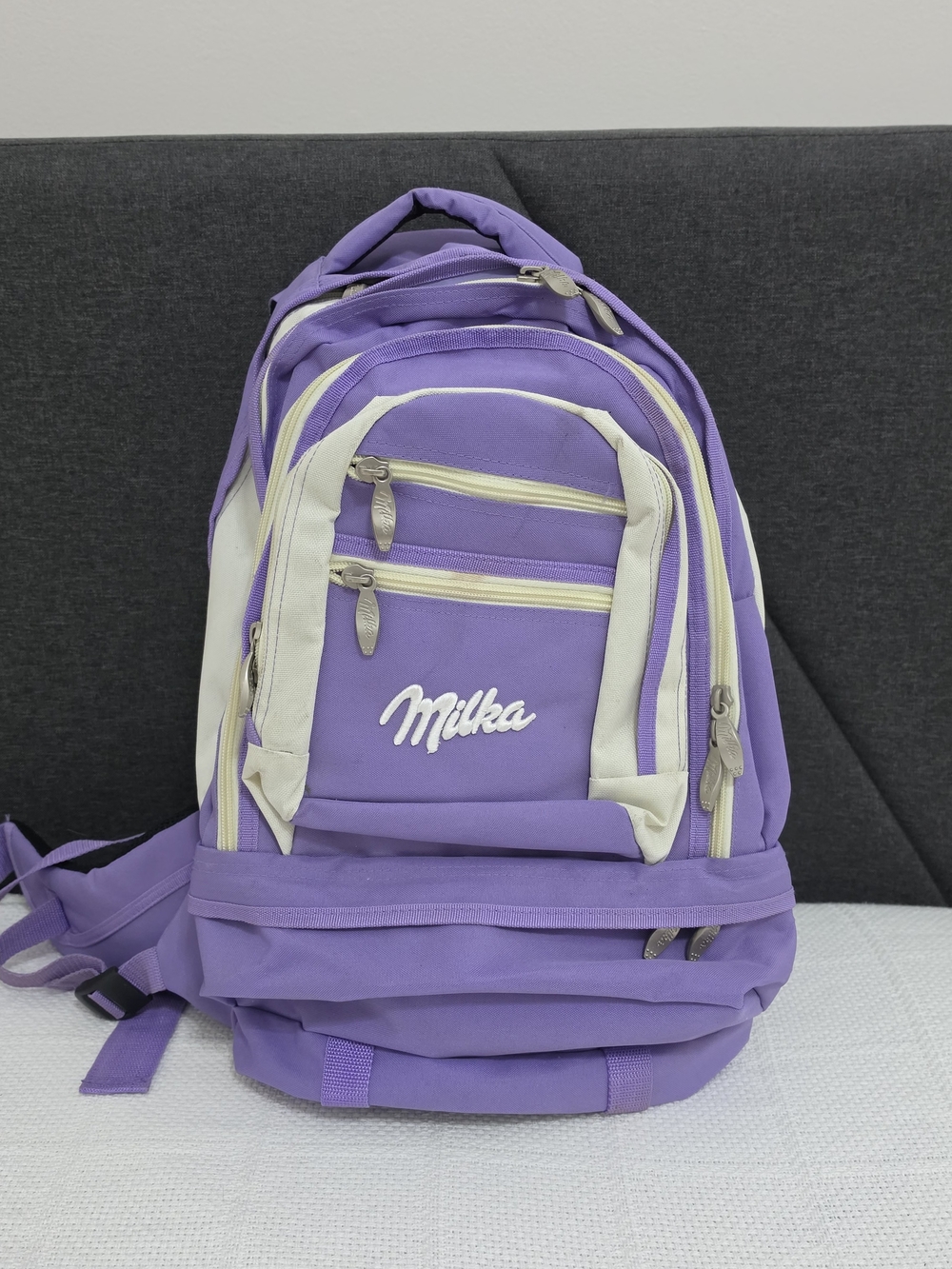 Milka purple multi-compartment backpack.